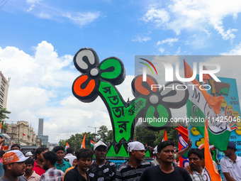 A large cutout of the TMC emblem is being seen during the annual martyrs' day rally held by the TMC party in Kolkata, India, on July 21, 202...