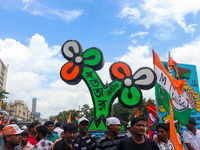 A large cutout of the TMC emblem is being seen during the annual martyrs' day rally held by the TMC party in Kolkata, India, on July 21, 202...