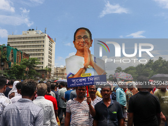 A large cutout of TMC supremo CM Mamata Banerjee is being seen at the annual martyrs' day rally held by the TMC party in Kolkata, India, on...