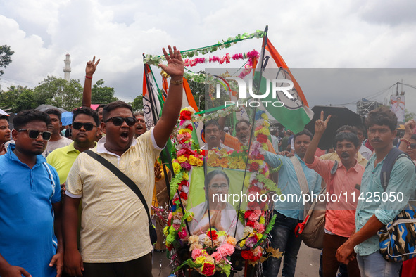 People are attending the annual Martyrs' Day rally held by the TMC party in Kolkata, India, on July 21, 2024. 