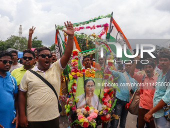 People are attending the annual Martyrs' Day rally held by the TMC party in Kolkata, India, on July 21, 2024. (