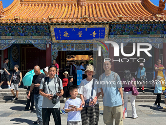 Tourists are visiting Wuliang Temple in Hohhot, Inner Mongolia, China, on July 4, 2024. (