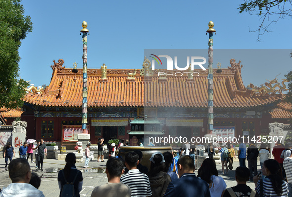 Tourists are visiting Wuliang Temple in Hohhot, Inner Mongolia, China, on July 4, 2024. 