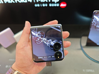 Customers are experiencing two fold-screen phones newly released by Xiaomi at a Xiaomi Home in Shanghai, China, on July 21, 2024. (