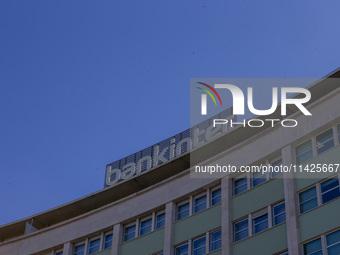 A bank logo is being seen on top of a building in Lisbon, Portugal, on July 21, 2024. An interruption of Microsoft systems, related to the c...