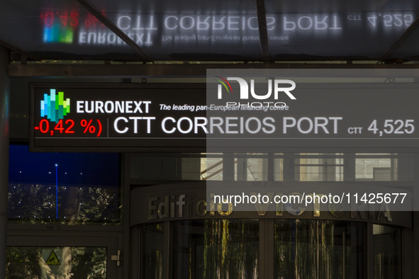 A screen with stock values in red is displaying at the Lisbon Stock Exchange building in Lisbon, Portugal, on July 21, 2024. An interruption...