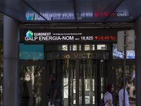 People are walking by the Lisbon Stock Exchange building in Lisbon, Portugal, on July 21, 2024. An interruption of Microsoft systems, relate...