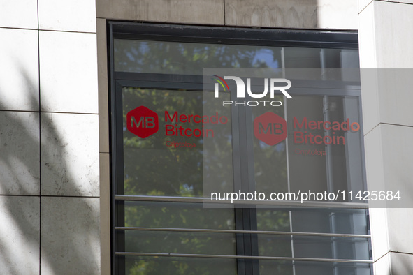 A Crypto store logo is being seen on a building in Lisbon, Portugal, on July 21, 2024. An interruption of Microsoft systems, related to the...