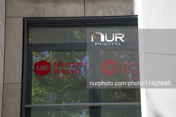 A Crypto store logo is being seen on a building in Lisbon, Portugal, on July 21, 2024. An interruption of Microsoft systems, related to the...