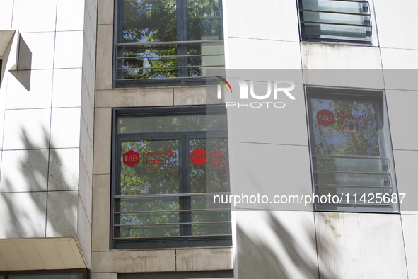 A Crypto store logo is being seen on a building in Lisbon, Portugal, on July 21, 2024. An interruption of Microsoft systems, related to the...