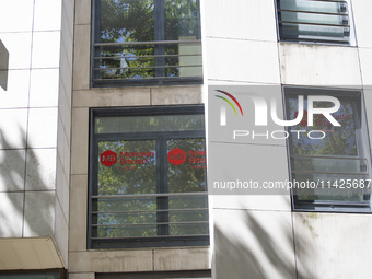 A Crypto store logo is being seen on a building in Lisbon, Portugal, on July 21, 2024. An interruption of Microsoft systems, related to the...