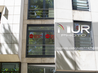 A Crypto store logo is being seen on a building in Lisbon, Portugal, on July 21, 2024. An interruption of Microsoft systems, related to the...