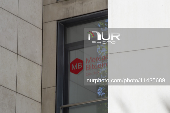 A Crypto store logo is being seen on a building in Lisbon, Portugal, on July 21, 2024. An interruption of Microsoft systems, related to the...