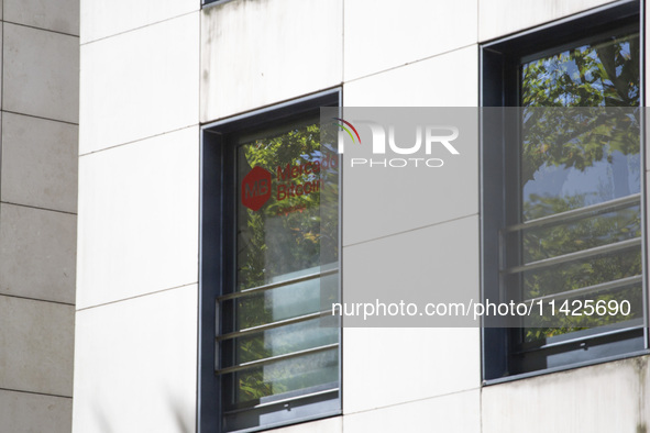 A Crypto store logo is being seen on a building in Lisbon, Portugal, on July 21, 2024. An interruption of Microsoft systems, related to the...