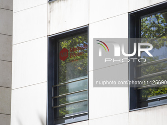 A Crypto store logo is being seen on a building in Lisbon, Portugal, on July 21, 2024. An interruption of Microsoft systems, related to the...