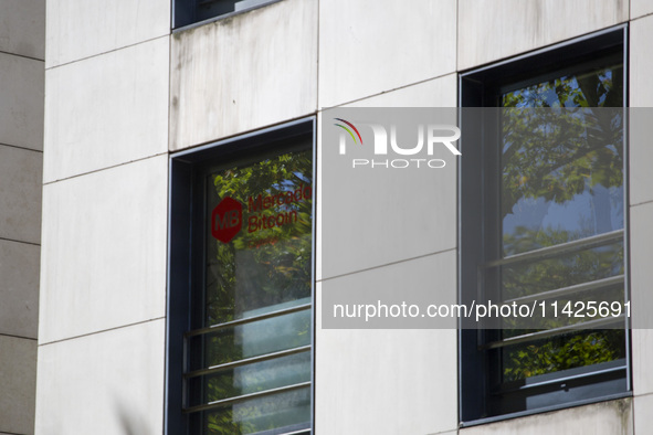 A Crypto store logo is being seen on a building in Lisbon, Portugal, on July 21, 2024. An interruption of Microsoft systems, related to the...