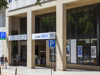 People are walking by an Abanca location in Lisbon, Portugal, on July 21, 2024. An interruption of Microsoft systems, related to the cyberse...