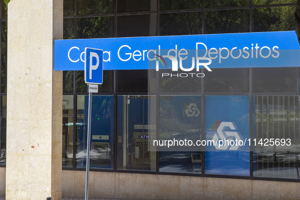 Cars are being seen reflected on a CGD building in Lisbon, Portugal, on July 21, 2024. An interruption of Microsoft systems, related to the...