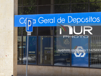 Cars are being seen reflected on a CGD building in Lisbon, Portugal, on July 21, 2024. An interruption of Microsoft systems, related to the...