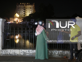 People are standing near the historic Sree Padmanabhaswamy Temple during the night of the Vishu Festival in Thiruvananthapuram (Trivandrum),...