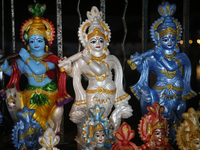 Clay idols of Lord Krishna are being sold along the roadside just outside the historic Sree Padmanabhaswamy Temple during the night of the V...