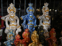 Clay idols of Lord Krishna are being sold along the roadside just outside the historic Sree Padmanabhaswamy Temple during the night of the V...