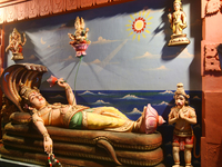 A figure of Padmanabhaswamy (Lord Vishnu in the 'Anantha Shayana' posture, the eternal yogic sleep on the infinite serpent Adi Shesha) is ad...