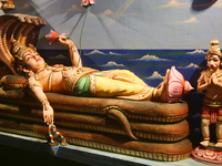 A figure of Padmanabhaswamy (Lord Vishnu in the 'Anantha Shayana' posture, the eternal yogic sleep on the infinite serpent Adi Shesha) is ad...