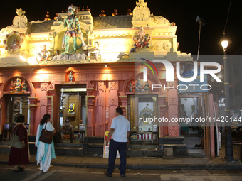 Devotees are offering prayers at the Sree Hanuman Swamy Temple during the night of the Vishu Festival in Thiruvananthapuram (Trivandrum), Ke...