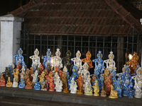 Clay idols of Lord Krishna are being sold along the roadside just outside the historic Sree Padmanabhaswamy Temple during the night of the V...