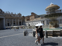 Tourists are filling up water bottles from a public fountain in Saint Peter, Rome, Italy, on July 21, 2024. (