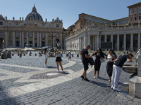 Tourists are filling up water bottles from a public fountain in Saint Peter, Rome, Italy, on July 21, 2024. (