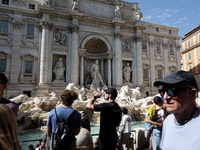 Tourists are trying to cool off with the help of fountains in the streets in Rome, Italy, on July 21, 2024, as the city is on alert for extr...