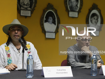 Catarino Hernandez (left), son of Carmelo Cortes, and Luis Carlos Pichardo Moreno (right), director of the Casa de la Memoria Indomita Museu...