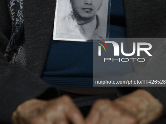 A photograph belonging to a victim of enforced disappearance in Mexico is being viewed. (