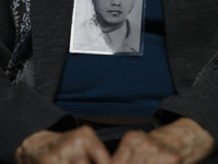 A photograph belonging to a victim of enforced disappearance in Mexico is being viewed. (