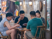 Residents are drinking tea at an old teahouse in a bomb shelter as the high temperature continues in Chongqing, China, on July 21, 2024. (