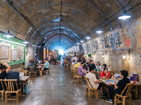 Residents are drinking tea at an old teahouse in a bomb shelter as the high temperature continues in Chongqing, China, on July 21, 2024. (