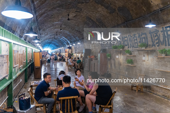 Residents are drinking tea at an old teahouse in a bomb shelter as the high temperature continues in Chongqing, China, on July 21, 2024. 