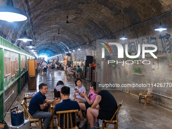 Residents are drinking tea at an old teahouse in a bomb shelter as the high temperature continues in Chongqing, China, on July 21, 2024. (