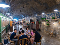 Residents are drinking tea at an old teahouse in a bomb shelter as the high temperature continues in Chongqing, China, on July 21, 2024. (