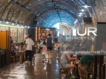 Residents are drinking tea at an old teahouse in a bomb shelter as the high temperature continues in Chongqing, China, on July 21, 2024. (