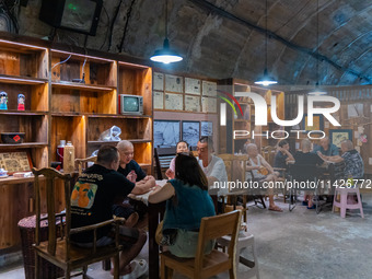 Residents are drinking tea at an old teahouse in a bomb shelter as the high temperature continues in Chongqing, China, on July 21, 2024. (