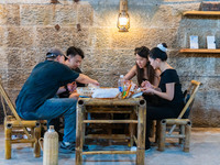 Residents are drinking tea at an old teahouse in a bomb shelter as the high temperature continues in Chongqing, China, on July 21, 2024. (