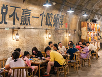 Residents are drinking tea at an old teahouse in a bomb shelter as the high temperature continues in Chongqing, China, on July 21, 2024. (