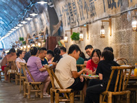 Residents are drinking tea at an old teahouse in a bomb shelter as the high temperature continues in Chongqing, China, on July 21, 2024. (