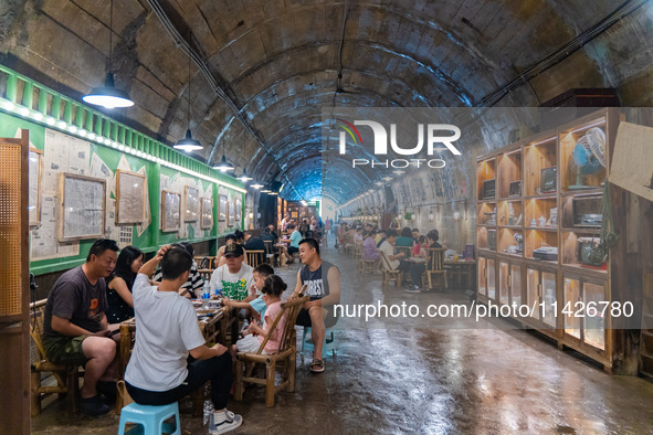 Residents are drinking tea at an old teahouse in a bomb shelter as the high temperature continues in Chongqing, China, on July 21, 2024. 