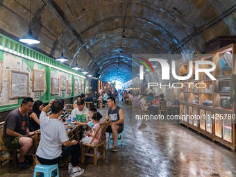 Residents are drinking tea at an old teahouse in a bomb shelter as the high temperature continues in Chongqing, China, on July 21, 2024. (