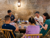 Residents are drinking tea at an old teahouse in a bomb shelter as the high temperature continues in Chongqing, China, on July 21, 2024. (