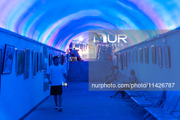 Citizens are cooling off in a bomb shelter as the high temperature continues in Chongqing, China, on July 21, 2024. 